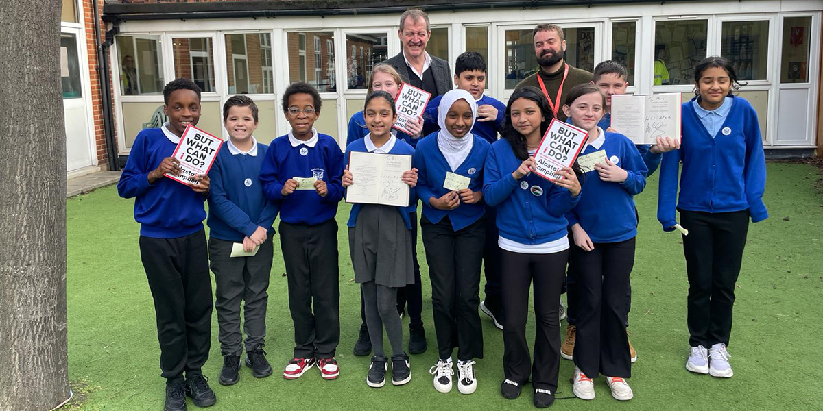 Some children from Richard Albion Primary School with Alastair Campbell